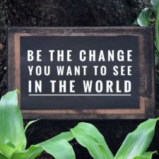 Motivational and inspirational quote - Be the change you want to see in the world. With vintage styled background.